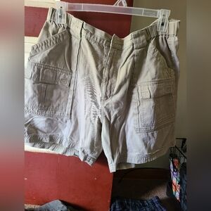 Gently worn men's khaki cargo shorts with elastic sides.